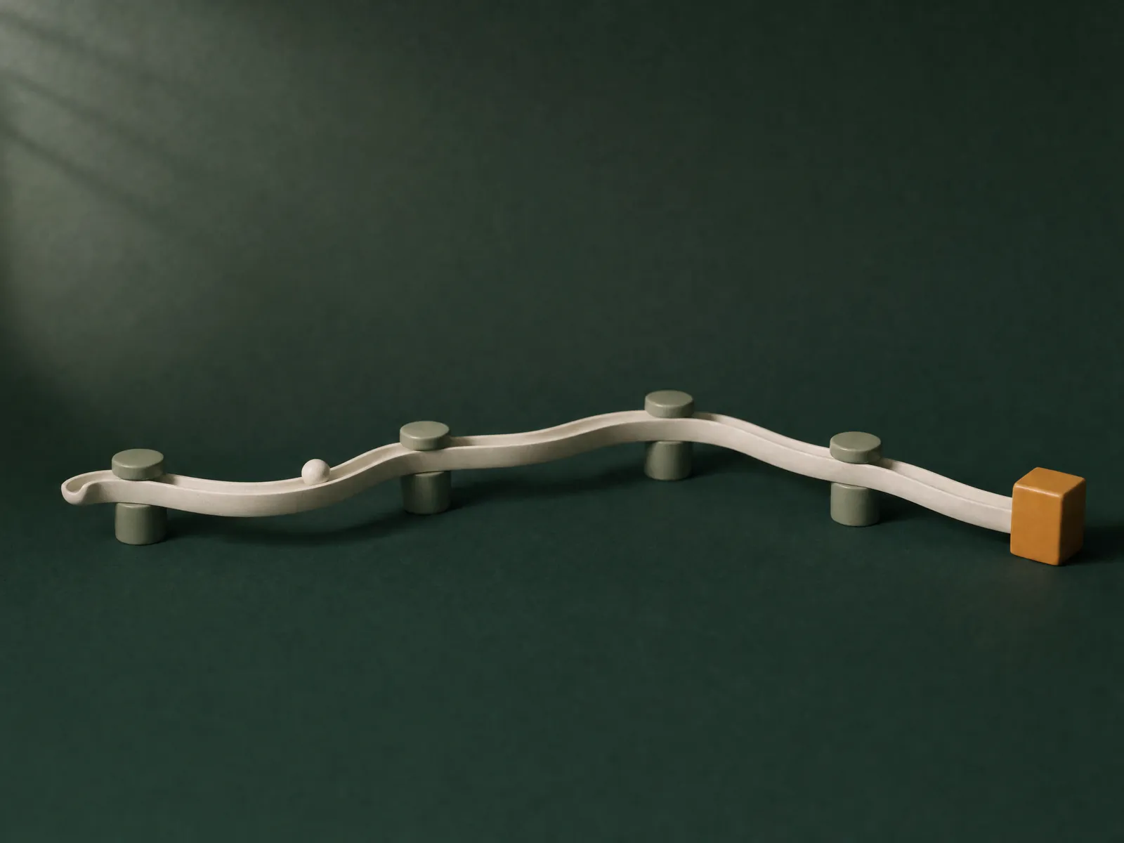 A ceramic channel running through sage-green nodes to a single amber block